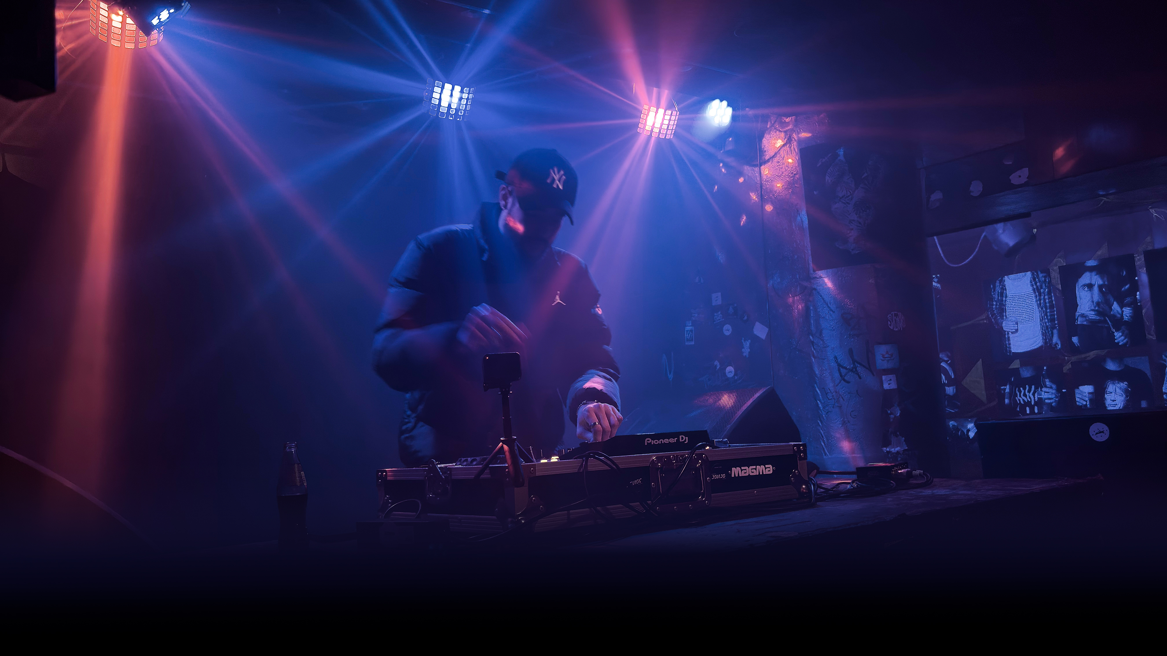 notrlly. performing live on stage with blue and purple stage lighting